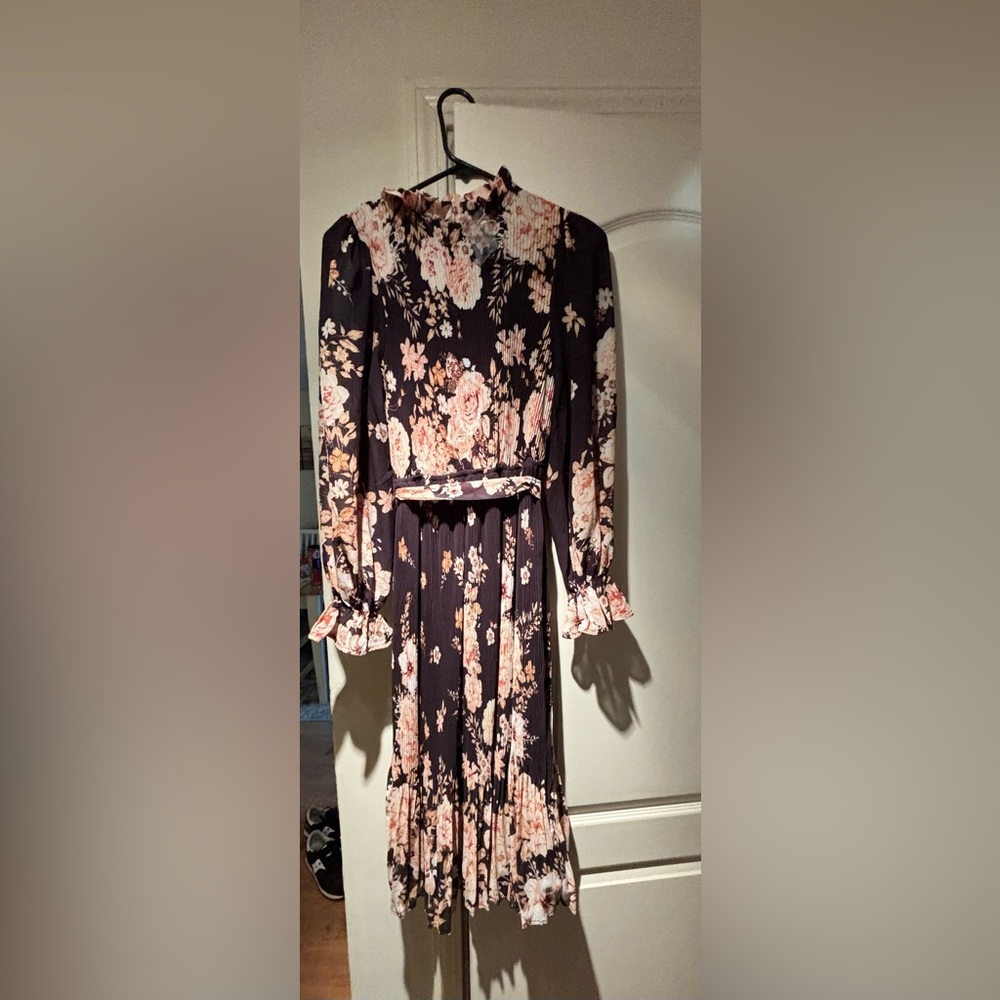 Brand new long sleeve midi dress with ruffle wrist.